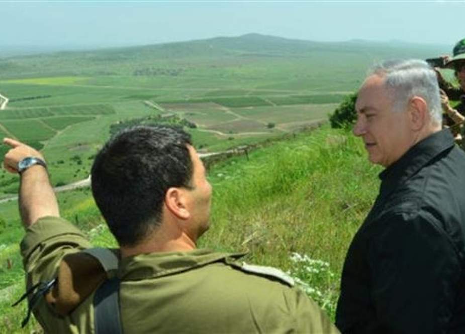 Israeli Prime Minister Benjamin Netanyahu (second from left) is seen during a tour of the occupied side of Syria’s Golan Heights.