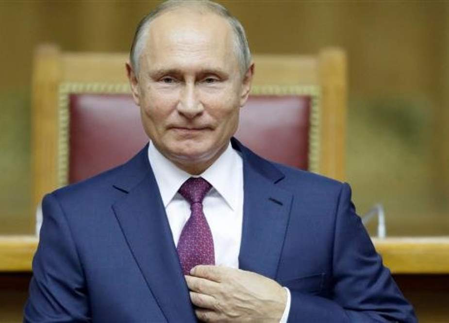 Russian President Vladimir Putin delivers a speech during a plenary session of the Second Eurasian Women