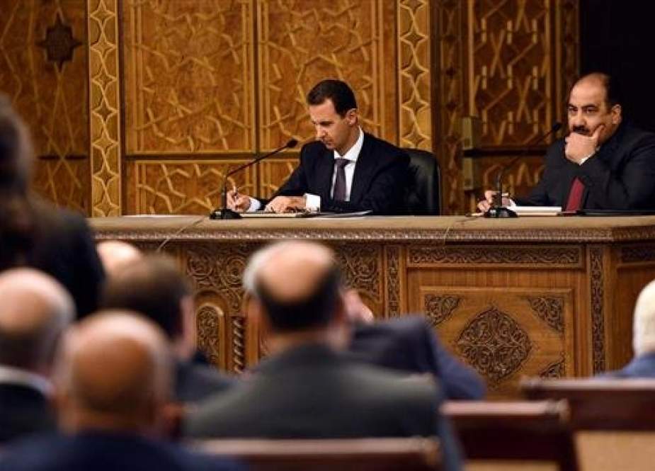 Syrian President Bashar al-Assad (L)