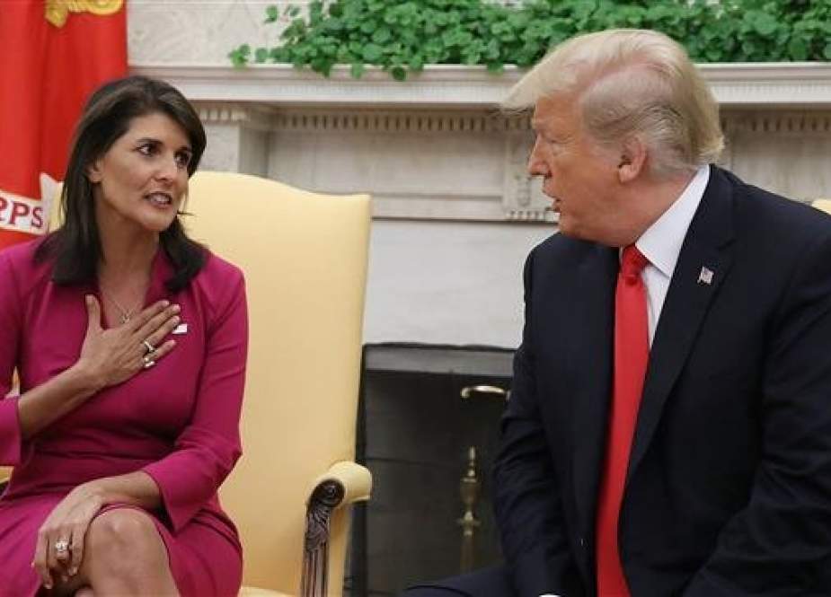 US President Donald Trump (R) announces that he has accepted the resignation of Nikki Haley (L) as the US ambassador to the United Nations, in the Oval Office of the White House on October 9, 2018 in Washington, DC. (Photo by AFP)