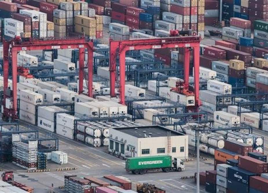 Chinese stacked shipping containers are seen at the Yangshan port in Shanghai on March 29, 2018. (Photo by AP)