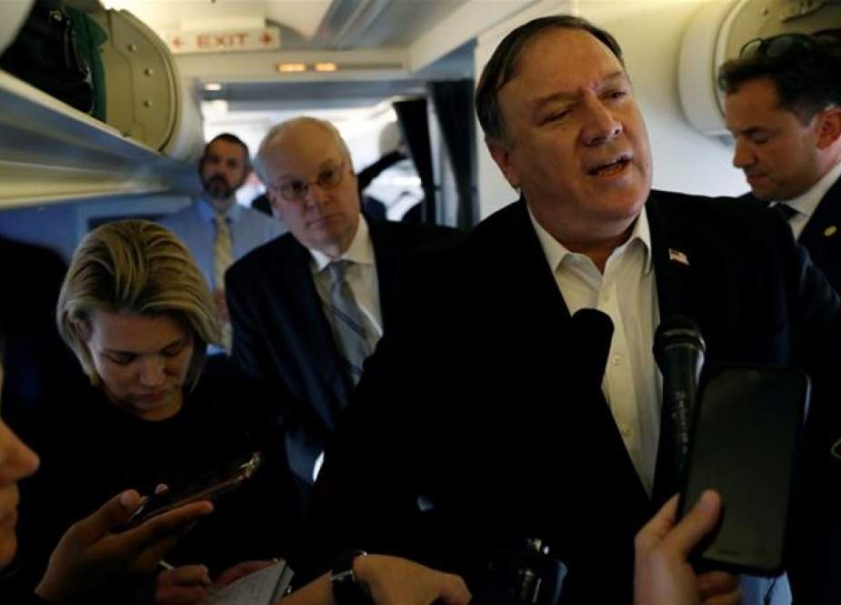 Mike Pompeo spoke to reporters while his plane was refueling in Brussels.jpg