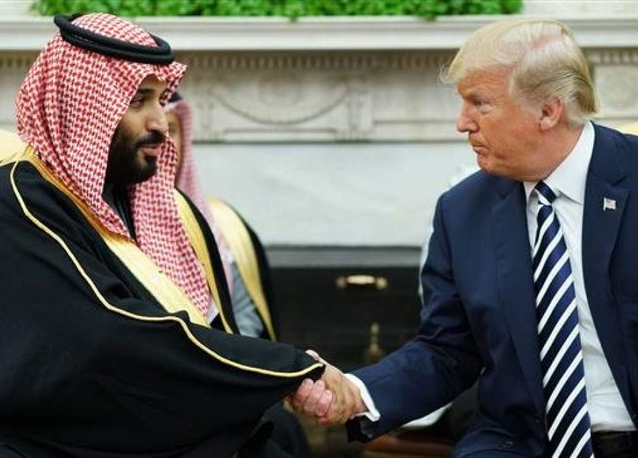 In this AFP file photo taken on March 20, 2018 US President Donald Trump (R) shakes hands with Saudi Arabia