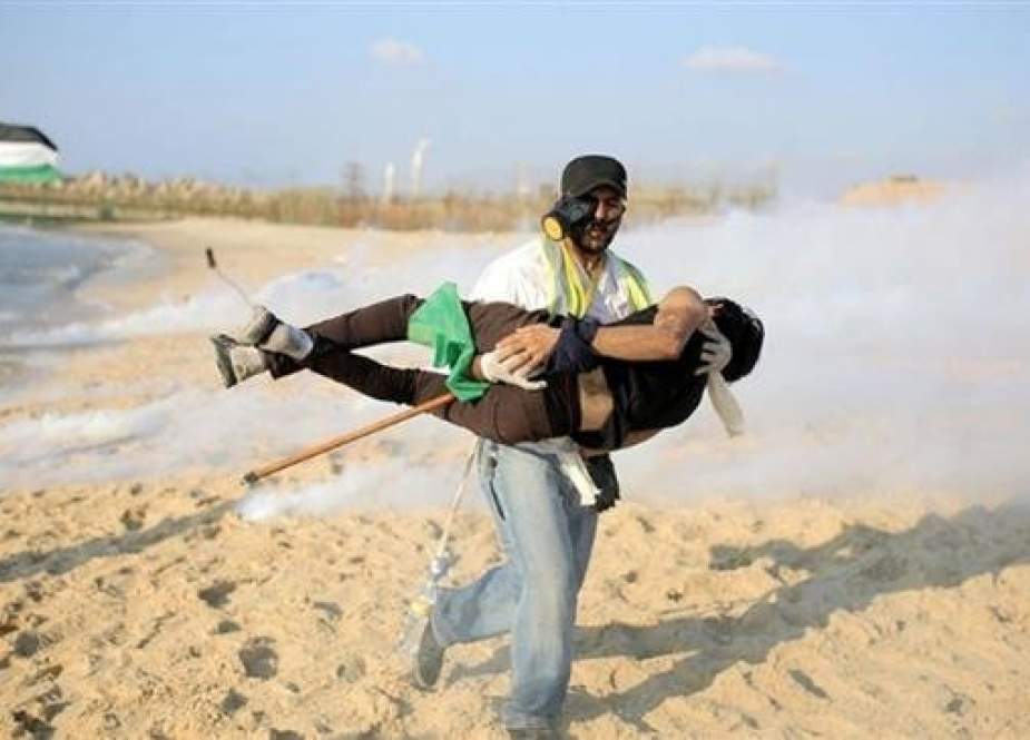 A Palestinian protester is injured in the northern part of the besieged Gaza Strip during a naval rally against the decade-long Israeli siege on the impoverished sliver on October 22, 2018. (Photo via Palestine Chronicle)