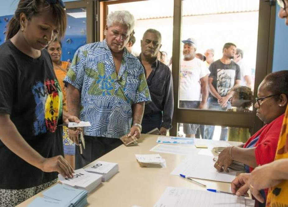 People line up to cast their ballots for or against independence for New Caledonia, in Noumea, New Caledonia, November 4, 2018. (Photo by AFP)