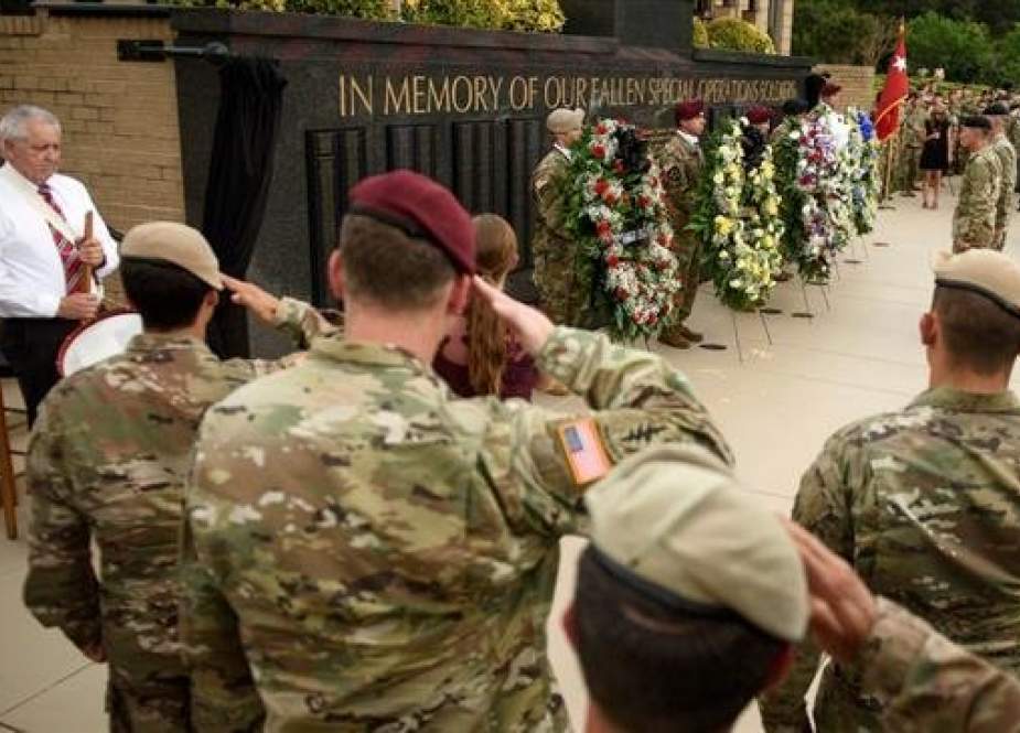 This file photo shows a ceremony last year where the names of four Special Forces soldiers killed in Niger were added to a memorial wall at Fort Bragg, N.C.