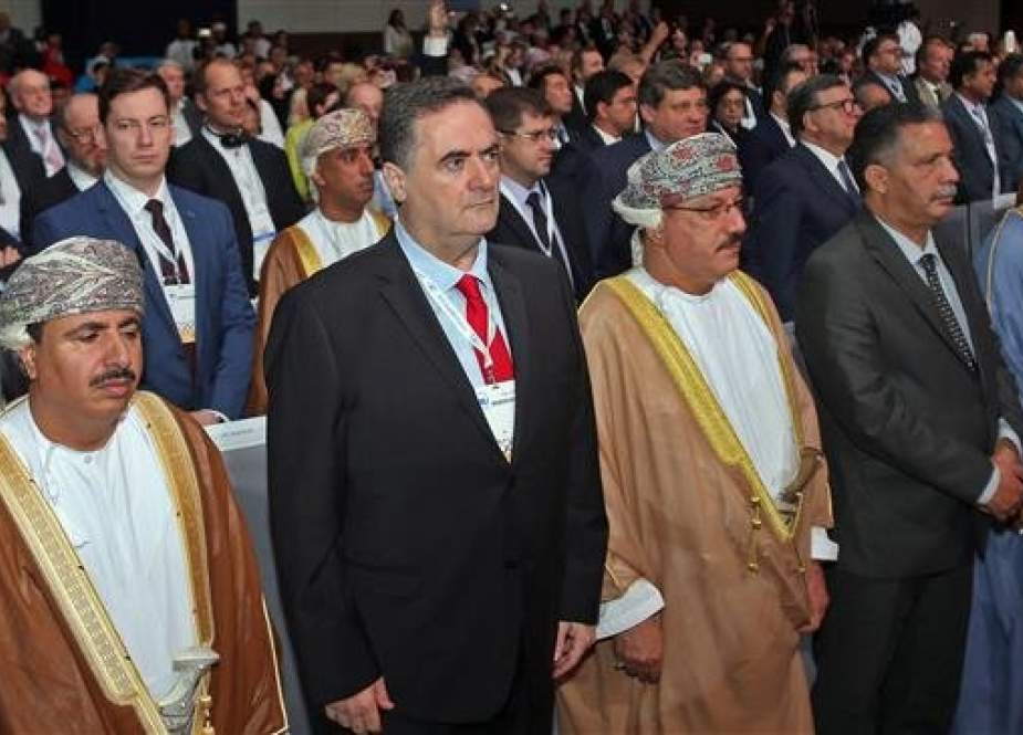 Israeli Minister of Transport Yisrael Katz (2nd-L) stands next to Omani officials during the opening ceremony of the IRU (International Road Transport Union) World Congress in Muscat on November 7, 2018. (Photo by AFP)