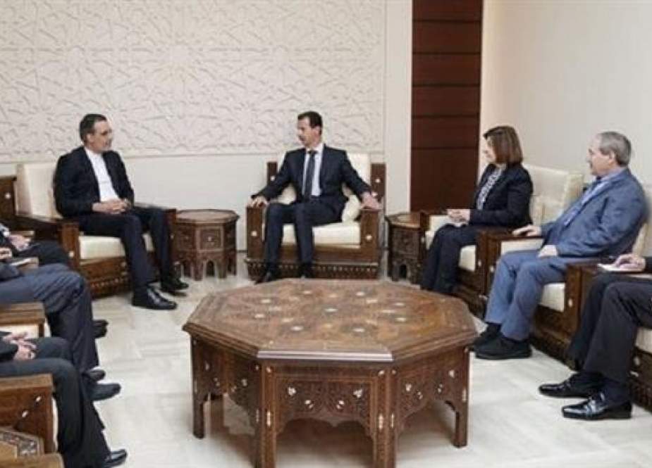 Hossein Jaberi Ansari, senior assistant to the Iranian foreign minister on special political affairs, (C-L) meets with Syrian President Bashar al-Assad (C-R) in Damascus on November 12, 2018. (Photo by SANA)