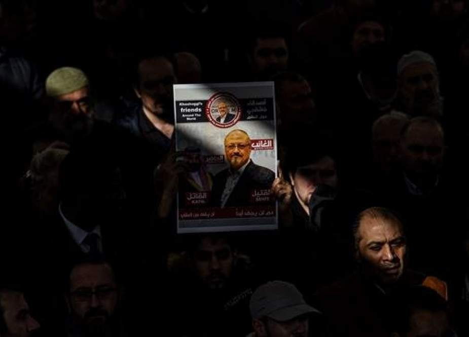 A person holds a banner of Jamal Khashoggi during a symbolic funeral prayer for the Saudi journalist, killed and dismembered in the Saudi consulate in Istanbul in October, at the courtyard of Fatih mosque in Istanbul, on November 16, 2018. (Photo by AFP)