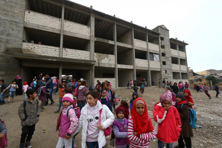 School children stand at a playground of a school in Raqqa, Syria November 5, 2018.