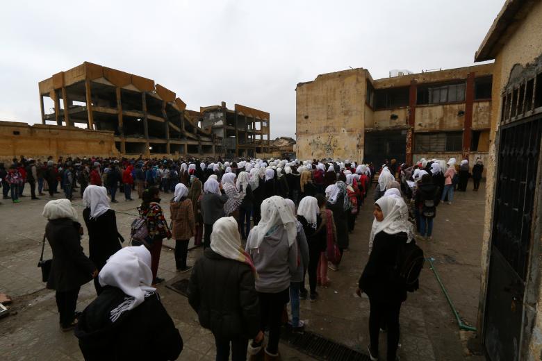 School children stand in line at a playground of a school in Raqqa, Syria November 5, 2018.