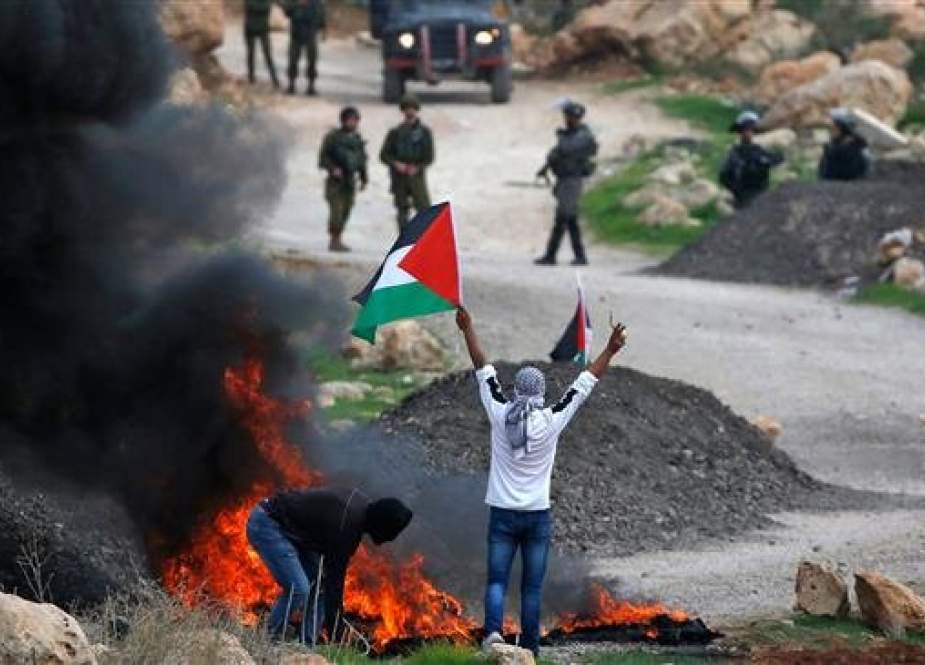 Palestinian demonstrators clash with Israeli forces.jpg