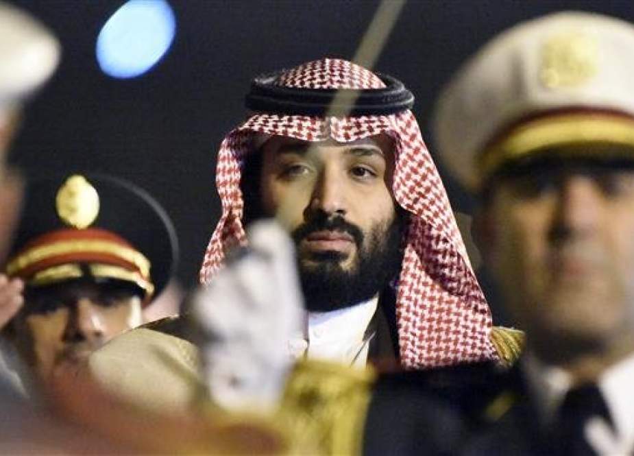Saudi Crown Prince Mohammed bin Salman is seen behind a military band upon his arrival at Algiers International Airport on December 2, 2018. (Photo by AFP)