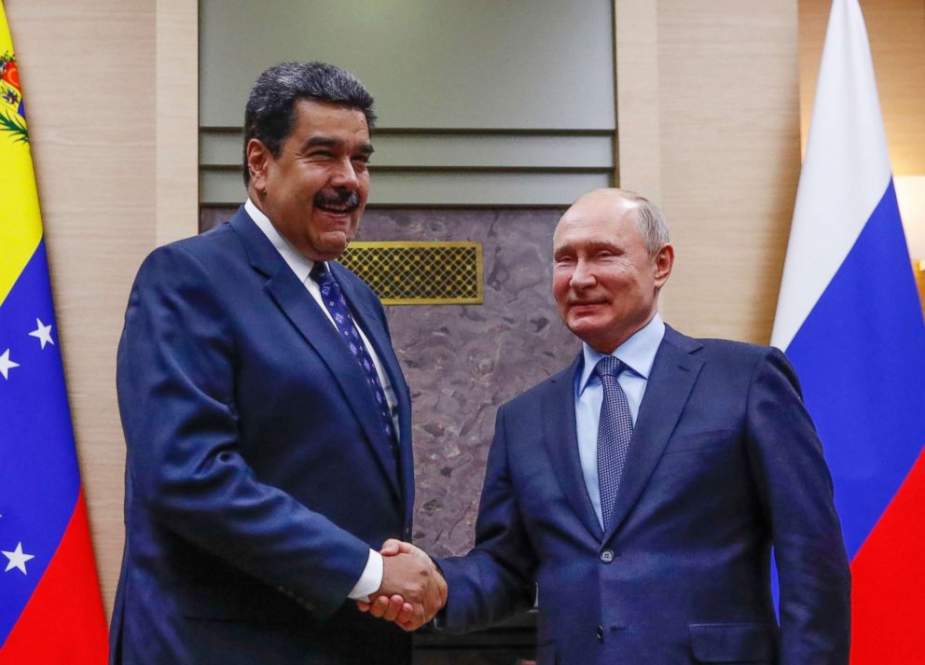 Russian President Vladimir Putin (R) shakes hands with his Venezuelan counterpart Nicolas Maduro during a meeting at the Novo-Ogaryovo state residence outside Moscow on December 5, 2018. (Photo by AFP)