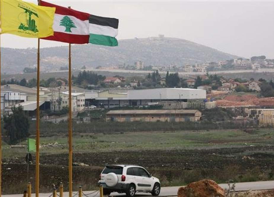 Flags of Hezbollah, Lebanon and Palestine are seen fluttering in the southern town of Khiam, Lebanon, December 4, 2018. (Photo by Reuters)