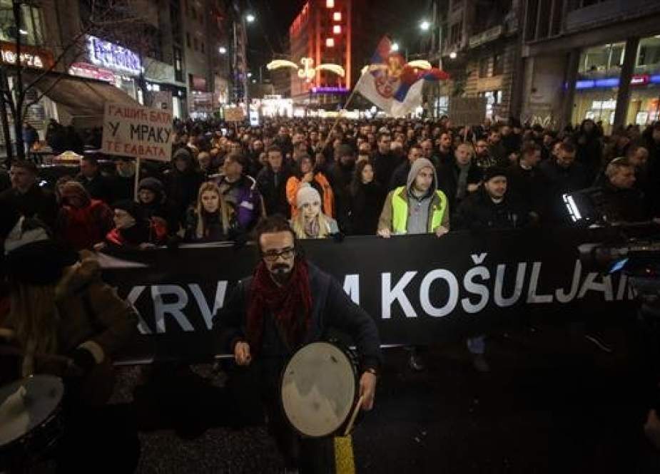 Demonstrators take part in a protest against the government, in the Serbian capital of Belgrade, on December 8, 2018. (Photo by AFP)