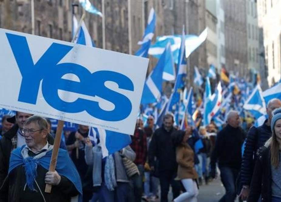 File photo shows people during a pro-independence march in Scotland.