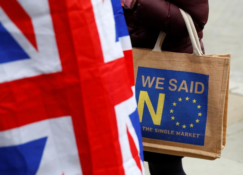 A Brexit supporter carries an anti-EU bag in London, December 10, 2018.