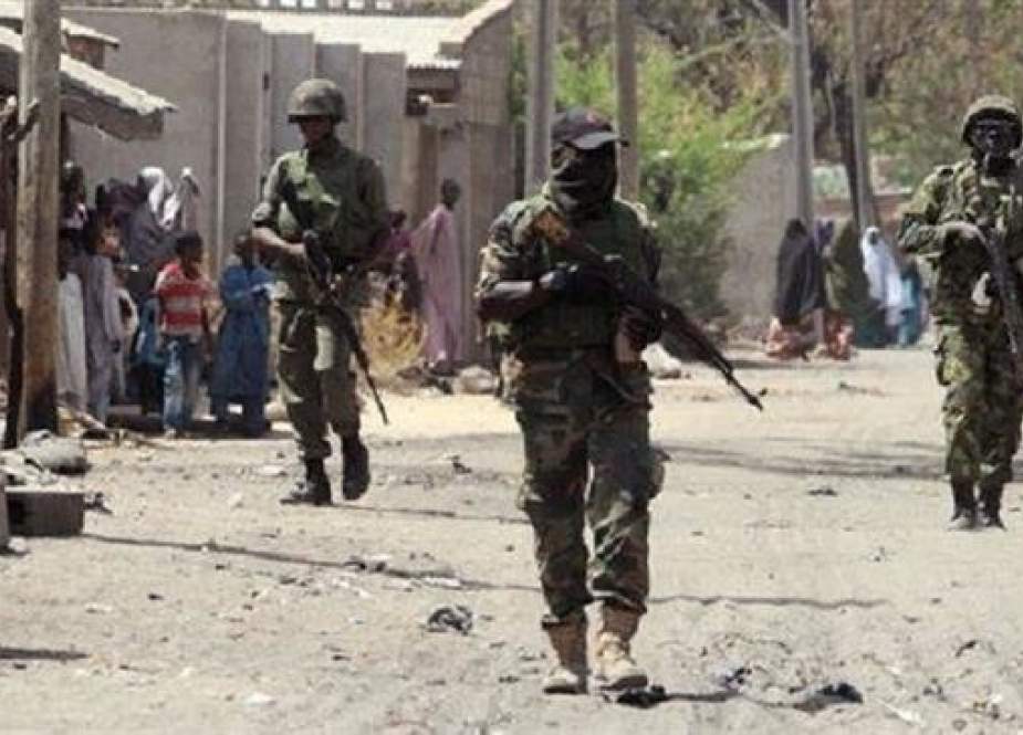 The undated photo shows Nigerian troops patrolling the streets of the town of Baga in the northeastern state of Borno.