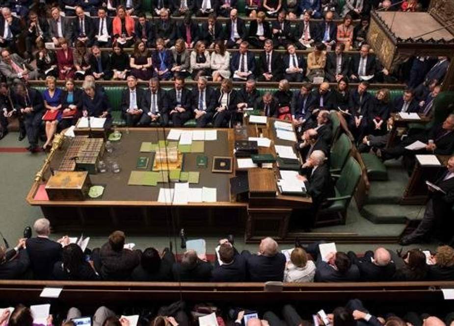 A handout photograph released by the UK Parliament shows members of the government and lawmakers during a weekly session of the House of Commons in London on December 12, 2018. (AFP photo)
