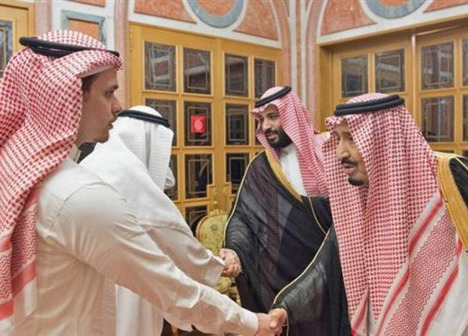 Khashoggi’s son, Salah, shakes hands with Saudi King Salman in an awkward meeting at the palace in Riyadh on Oct. 23, 2018.