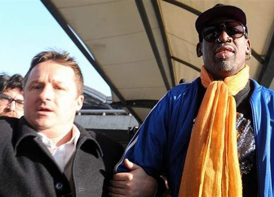 In this file photo taken on January 13, 2014 Michael Spavor (L) and former US basketball player Dennis Rodman (R) arrive at Beijing International Airport from North Korea. (By AFP)