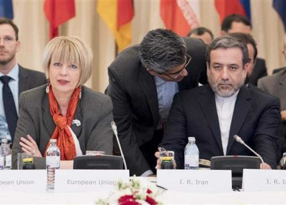 Senior EU diplomat Helga Schmid (L) and Iranian deputy foreign minister Abbas Araqchi (R) meet in Vienna, Austria on April 25, 2017 for a regular quarterly meeting to review adherence to their 2015 nuclear deal. (Photo by AFP)