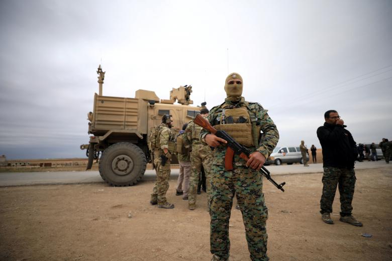 Syrian Democratic Forces and U.S. troops are seen during a patrol near Turkish border in Hasakah, November 4, 2018.