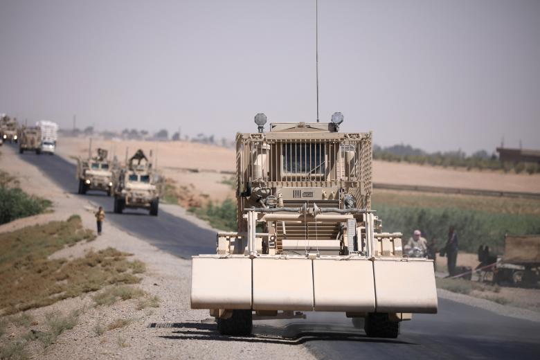 A U.S military demining vehicle leads a convoy on the main road in Raqqa, July 31, 2017.