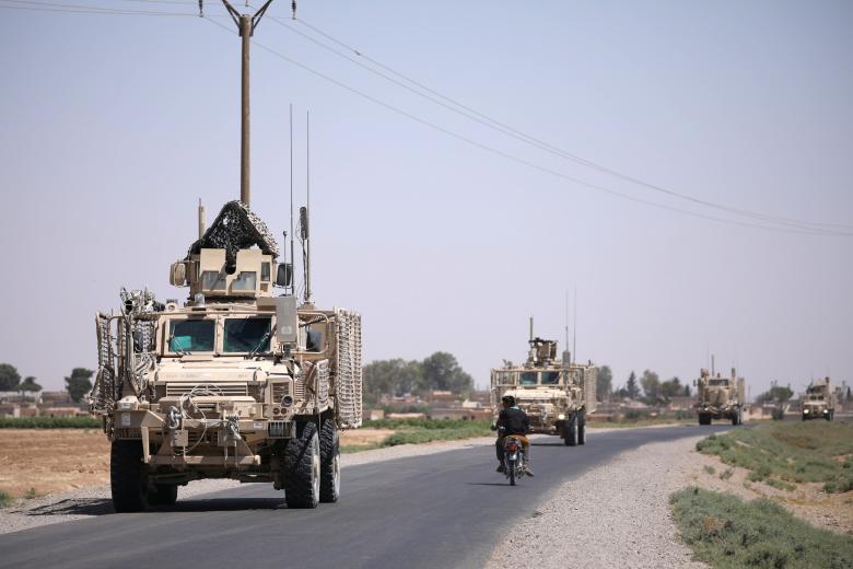 A U.S military convoy is seen on the main road in Raqqa July 31, 201.