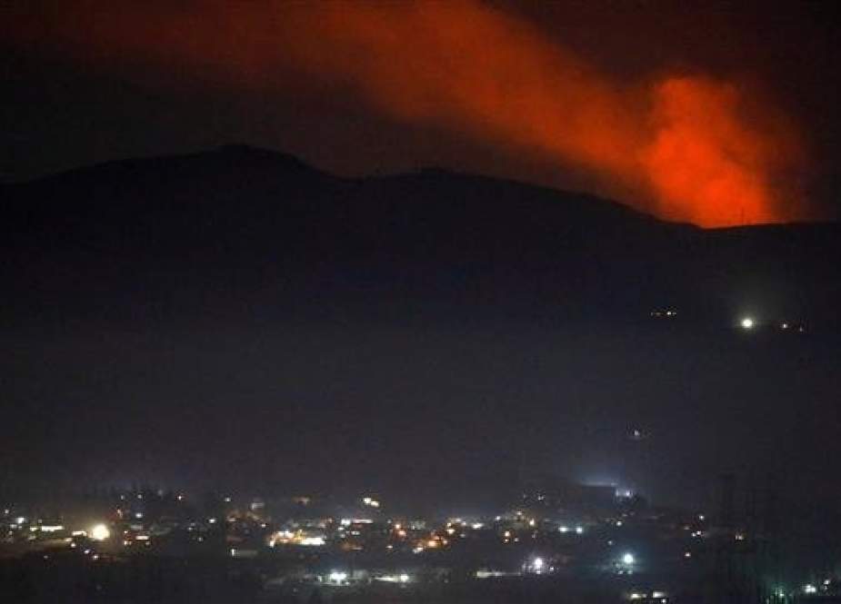 Smoke rises past a mountain as seen from Damascus countryside, December 25, 2018, following an Israeli missile attack in Syria. (Photo by Reuters)