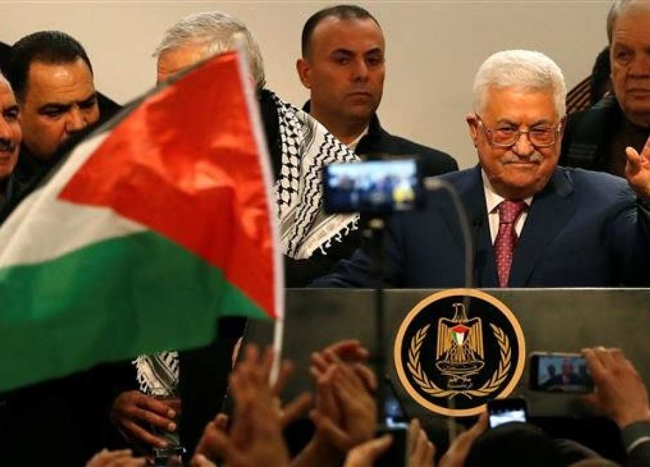 Palestinian President Mahmoud Abbas gestures during a ceremony marking the 54th anniversary of the Fatah party