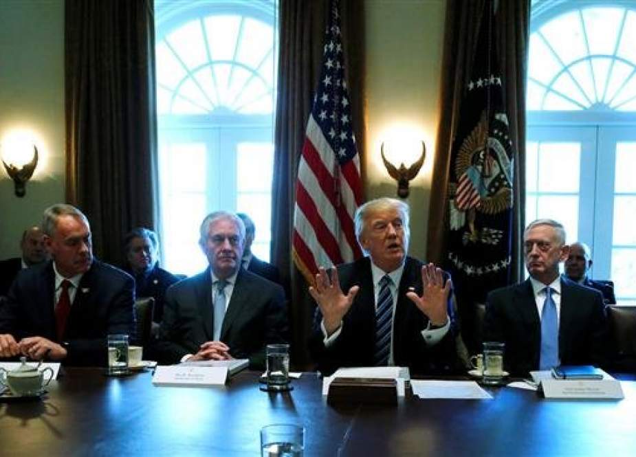 United States President Donald Trump (C) poses for a picture amid a cabinet meeting at the White House, in Washington, DC, on March 13, 2017. (Photo by Reuters)