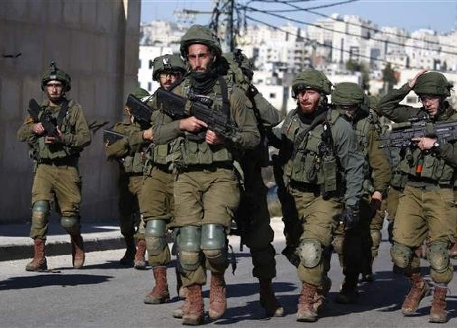 Israeli troops withdraw from Ramallah in the Israeli-occupied West Bank after blowing up a house belonging to a Palestinian accused of killing an Israeli soldier a few months ago, on December 15, 2018.