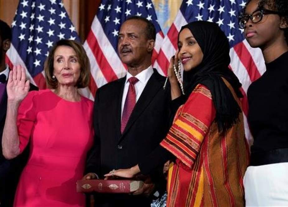 Representative Ilhan Omar (D-MN) poses with Speaker of the House Nancy Pelosi (D-CA) for a ceremonial swearing in picture on Capitol Hill in Washington, US, January 3, 2019. (Photo by Reuters)