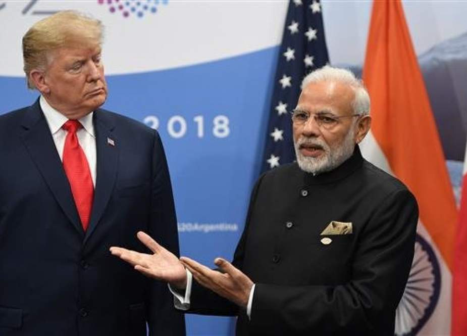 US President Donald Trump listens to India