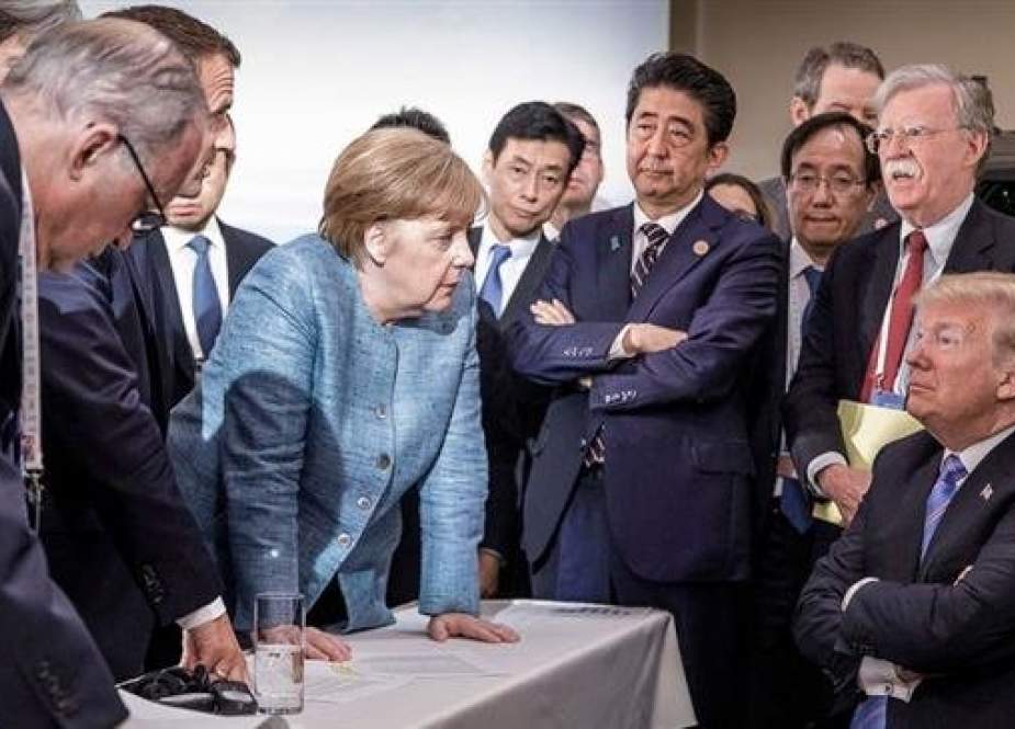 A handout photograph from the German government shows a group of leaders at the Group of Seven summit, including German Chancellor Angela Merkel and President Trump, in Canada on June 9, 2018. (Photo by EPA-EFE)