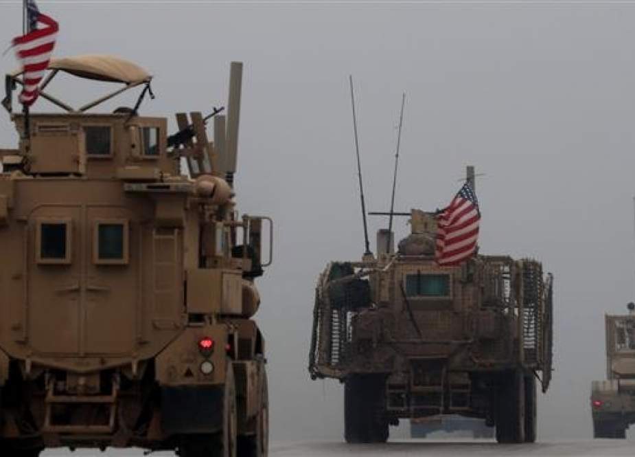 (FILES) This file photo taken on December 30, 2018, shows a line of US military vehicles in Syria.(Photo by AFP)