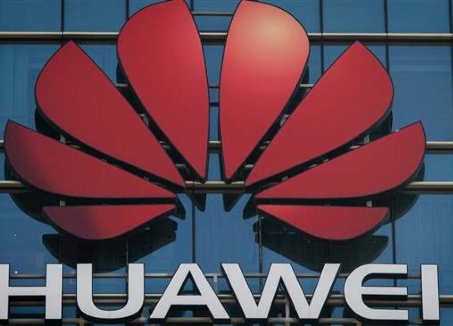 The Huawei logo stands on a Huawei office building in Dongguan in China’s southern Guangdong province on December 18, 2018. (Photo by AFP)