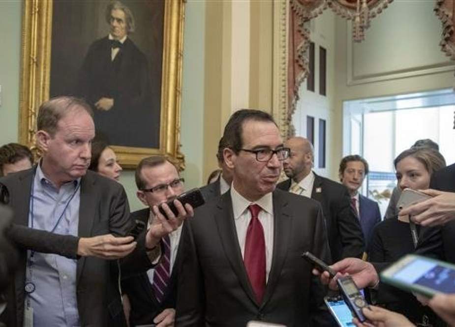 US Treasury Secretary Steven Mnuchin (C) speaks to members of the media after meeting with Senate Republicans on Capitol Hill on January 15, 2019 in Washington, DC. (Photo by AFP)