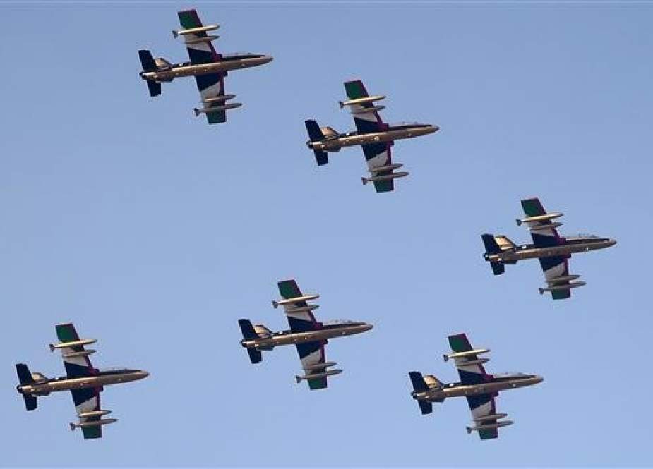 Emirati fighter jets fly past the Sheikh Zayed International Cricket Stadium in Abu Dhabi, the UAE, December 2, 2018. (Photo by AFP)
