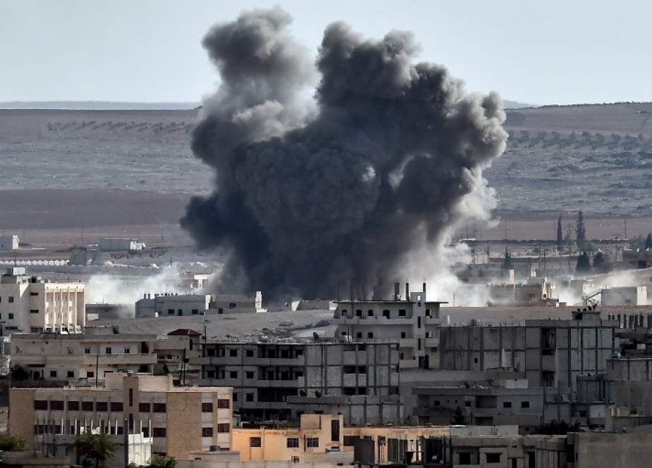 In this file picture, smoke rises after an airstrike from US-led coalition in the city of Kobane, also known as Ain al-Arab, seen from the southeastern border village of Mursitpinar, Sanliurfa province, Turkey. (Photo by AFP)