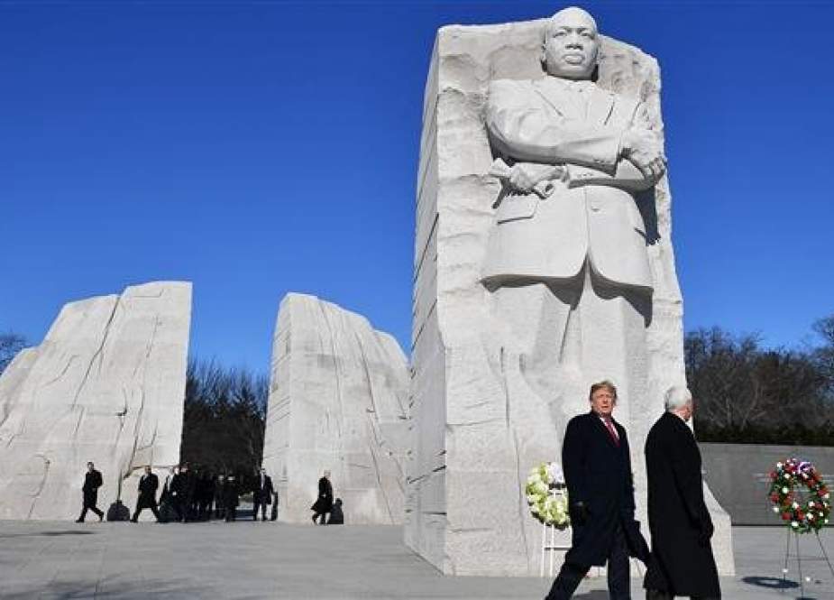 US President Donald Trump(L) and US Vice President Mike Pence(C) visit the Martin Luther King Jr. Memorial in Washington, DC on Martin Luther King Day on January 21, 2019. (Photo by AFP)