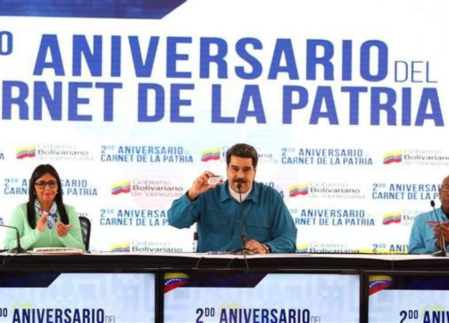 This handout picture, released by the Venezuelan presidency, shows Venezuelan President Nicolas Maduro (C) next to Vice President Delcy Rodriguez (L) and Education Minister Aristobulo Isturiz, in Caracas, on January 22, 2019. (Via AFP)