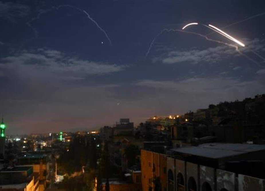 A picture taken early on January 21, 2019, shows Syrian air defense batteries responding to Israeli missiles targeting Damascus. (Photo by AFP)