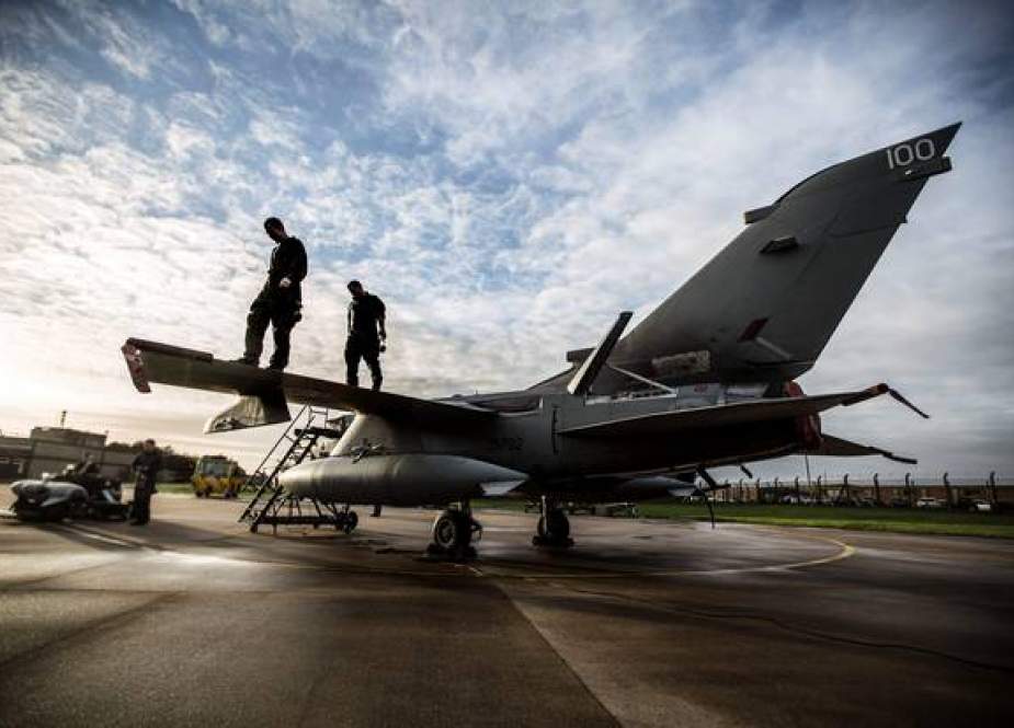 Groundcrew work on a Tornado GR4 from RAF Marham as it prepares for a practice mission, the Tornado