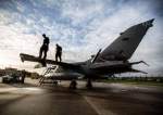 Groundcrew work on a Tornado GR4 from RAF Marham as it prepares for a practice mission, the Tornado