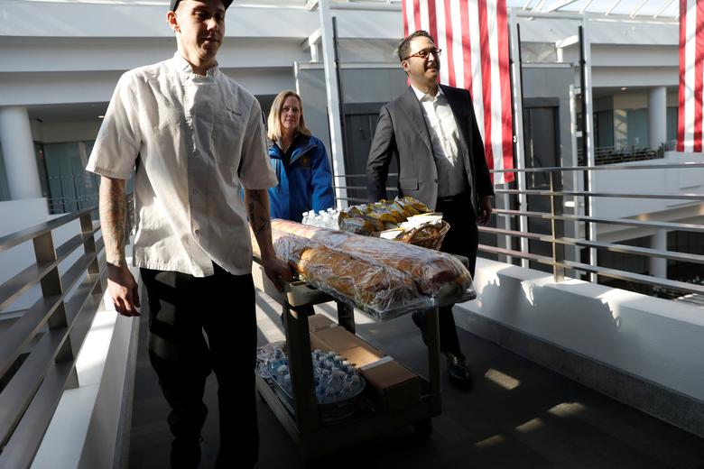 Queens Borough President Melinda Katz and Brad Blumenfeld, Vice President of Blumenfeld Development Group, deliver free lunch to Transportation Security Administration (TSA) employees working without pay at the TSA offices inside the Bulova Corporate Cen