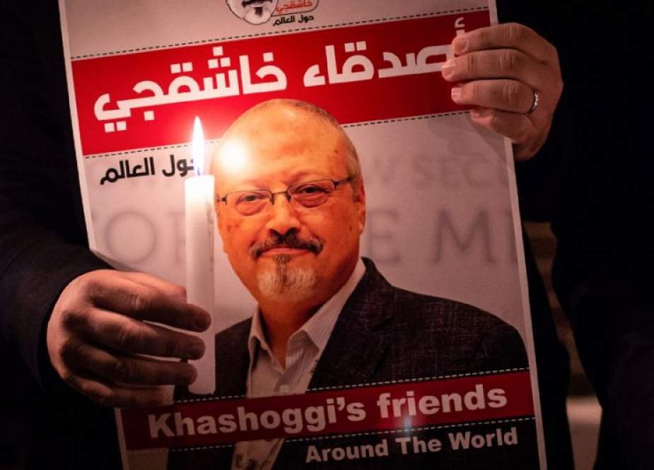 A demonstrator holds a poster with a picture of Saudi journalist Jamal Khashoggi outside the Saudi consulate in Istanbul, Turkey, on October 25, 2018.
