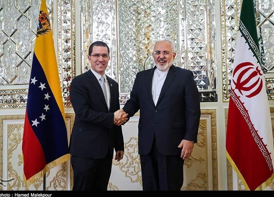 Iranian Foreign Minister Mohammad Javad Zarif, right, and his Venezuelan counterpart Jorge Arreaza